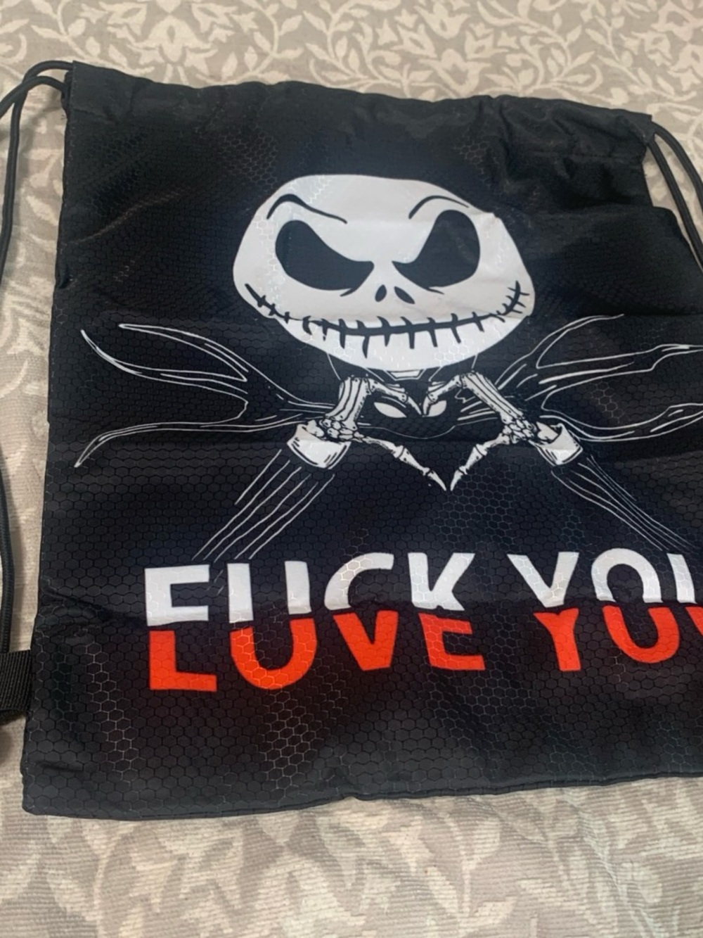 Black Graphic Drawstring Satchel with White Skull and Red Accent